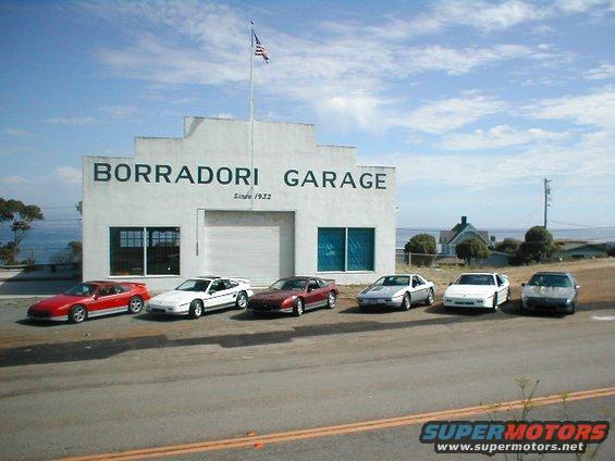 Six Pontiac Fieros parked in front of Borradori Garage