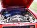 1978 Ford Mustang II - The engine bay of a red vehicle is shown, a blue air cleaner and visible engine components. A watermark from Supermotors.net is present.