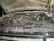 1988 Ford Bronco - The engine bay of a 1988 Ford Bronco shows various hoses, the fan, and other engine components.