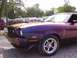 1978 Ford Mustang II - This 1978 Ford Mustang II features a distinctive purple and orange paint scheme, a cobra emblem, and a 347 badge.