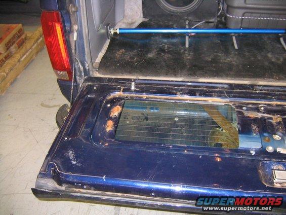 the window all the way down because the u-bolt holds the spring up