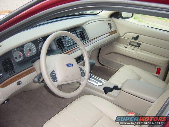 2004 Ford Crown Victoria interior showing dashboard, steering wheel, and seats