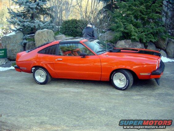 Orange 1978 Ford Mustang II coupe with black hood stripes and aftermarket wheels