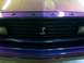 1978 Ford Mustang II - The grille features the iconic snake emblem and 'FORD' lettering on a purple-painted hood.