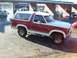 1986 Ford Bronco - This 1986 Ford Bronco has a two-tone red and white paint scheme with a white removable top.