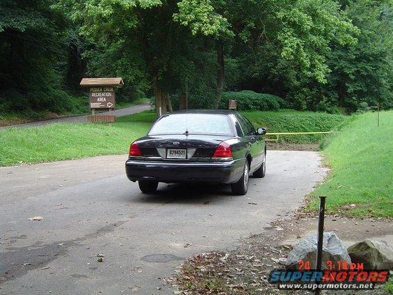 Black 1999 Ford Crown Victoria from rear
