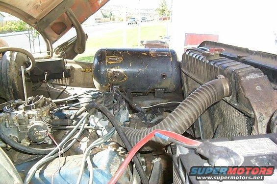 1978 Ford Bronco engine bay showing carburetor, radiator, and air tank