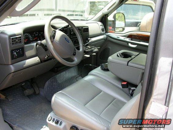 Gray truck interior with leather seats, dashboard, and steering wheel