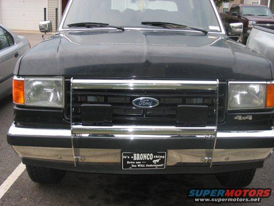 Black 1988 Ford Bronco front with chrome grille and "It's a Bronco thing" plate