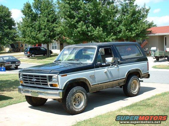 Two-tone black and silver Ford Bronco with BFGoodrich tires, parked on a driveway