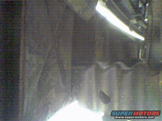 Underside of a vehicle, possibly the frame and suspension components