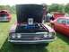 1969 Ford Fairlane - Maroon 1970-1971 Ford Torino at a car show with hood open and award displayed. A red Pontiac Firebird is parked nearby.