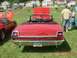 1969 Ford Fairlane - A red 1969 Ford Fairlane convertible is parked on grass with its hood up, alongside another car.