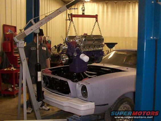 1978 Ford Mustang II with engine being installed using an engine hoist