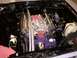 1978 Ford Mustang II - Customized V8 engine bay with chrome and purple accents, viewed from above.