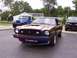 1978 Ford Mustang II - This iridescent coupe's body style is indicative of a mid-1970s vehicle, likely from around 1975.