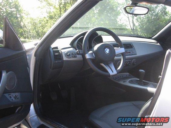 Interior of a 2003 BMW Z4 showing dashboard, steering wheel, and gear shift