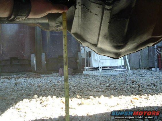 14-bolt-008.jpg bottom of diff is about 9 1/2" from the ground. not great, but i'd rather have 9" under a 14 bolt than 20" under an 8.8