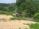 1988 Ford Bronco - 1988 Ford Bronco tackles a challenging off-road trail.