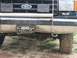 1988 Ford Bronco - A close-up of the front grille and bumper of a Ford Bronco, showing a custom license plate and '4x4' badging.