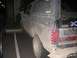 1988 Ford Bronco - This mud-caked Ford Bronco is parked in a parking lot, showing off its off-road adventures.