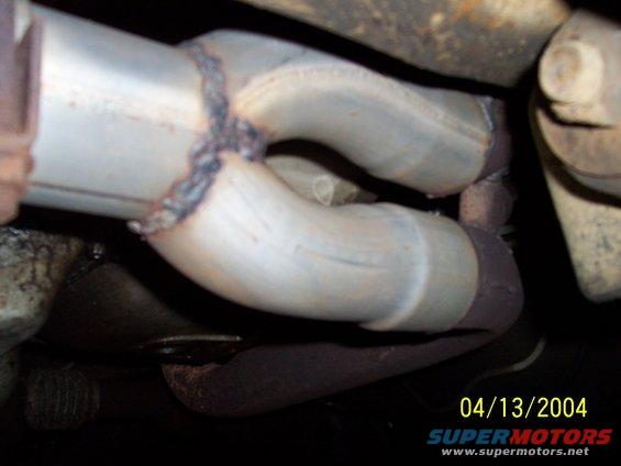 Exhaust pipe with a weld and date stamp 04/13/2004