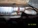 1994 Ford Bronco - Close-up of a vehicle's exhaust system components, including a catalytic converter.