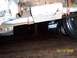 1994 Ford Bronco - The photo shows the exhaust system of a vehicle, with another car partially visible beneath it.