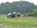 1988 Ford Bronco - This dark blue Ford Bronco appears to be from the mid-1990s, not 1988, as it navigates an off-road course.