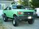 1990 Ford Bronco - This lifted 1990 Ford Bronco is parked in a gravel driveway.