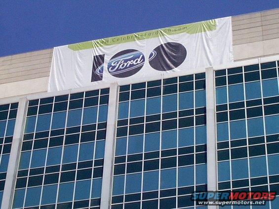 Building with a banner celebrating Ford's 100th anniversary