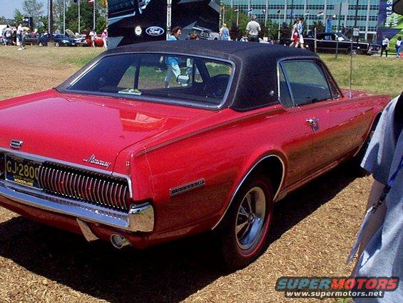Red 1969 Mercury Cougar XR7 rear view with black vinyl top