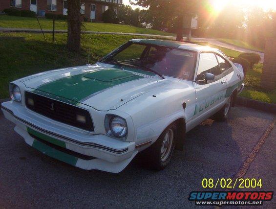 White and green 1974 Ford Mustang II Cobra coupe with racing stripes