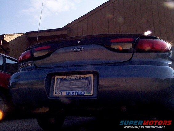 Dark blue 1999 Ford Taurus rear with Michigan license plate