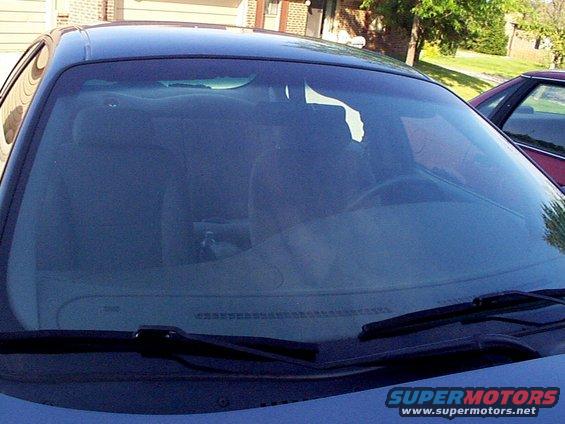Car windshield view, another car parked nearby