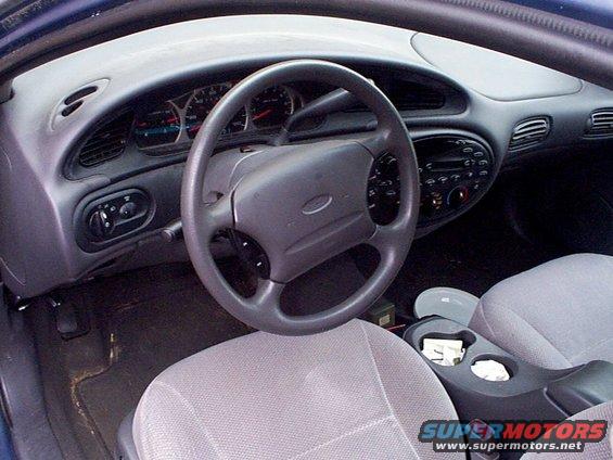 1999 Ford Taurus interior showing dashboard, steering wheel, and front seats