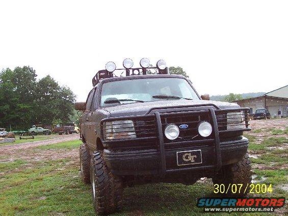 Black 1995 Ford Bronco with bull bar and roof lights