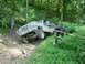 1995 Ford Bronco - A group of people are off-roading when one vehicle gets stuck on a steep, wooded trail.