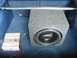 1993 Ford Probe - Aftermarket car audio equipment installed in the trunk, including a subwoofer and amplifier.