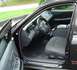1999 Ford Crown Victoria - The interior of a 1999 Ford Crown Victoria is visible with the driver's side door open.