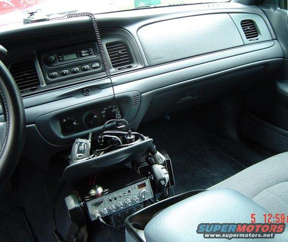 Interior of a 1999 Ford Crown Victoria with CB radio and scanner