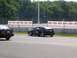 1990 Jeep YJ - A black Volkswagen Corrado is parked on a track with its door open, with another car nearby.