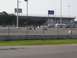 1990 Jeep YJ - Go-karts race around a track with an ambulance and tents visible near the grandstands.