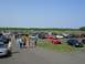 1990 Jeep YJ - A large gathering of cars parked at an outdoor event on a sunny day.