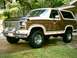 1984 Ford Bronco - This two-tone 1984 Ford Bronco is shown in a three-quarter front view.