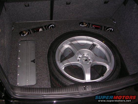 Custom trunk subwoofer box with OZ Racing wheel and JL Audio amplifier