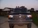 1989 Ford Bronco - This 1987 Ford Bronco is shown from the front with a chrome bumper and roof-mounted lights.
