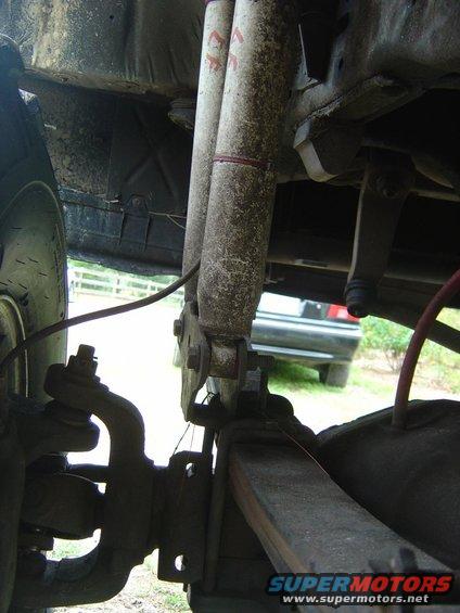 Close-up of suspension with shock absorbers and leaf spring