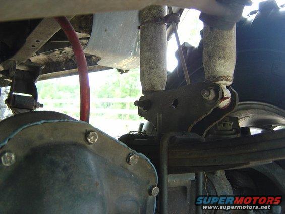 Rear axle housing, leaf springs, and shock absorbers on a vehicle