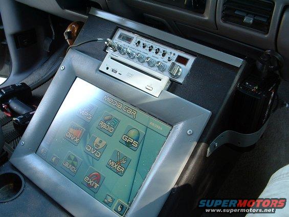 dscf0008.jpg Carputer, built the console to fit.  Setup with mp3's, divx, dvd, and gps.